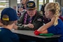 Tom Foreman, retired U.S. Navy gun director, speaks to students with Mokapu Elementary School during his visit, Marine Corps Base Hawaii, Dec. 5, 2019. The Best Defense Foundation returned 6 WWII Pearl Harbor and Naval Air Station Kaneohe Bay survivors to Hawaii for the 78th Commemoration of Pearl Harbor and Naval Air Station Kaneohe Bay which is now MCBH. The heroes returned were Jack Holder US NAVY - Naval Air Station, Kaneohe Bay; Tom Foreman US Navy - USS Cushing; Ira Schab US Navy - USS Dobbin; Stuart Hedley US Navy - USS West Virginia; Donald Long US Navy - Naval Air Station, Kaneohe Bay; and Chuck Kohler US Navy - USS Hornet.