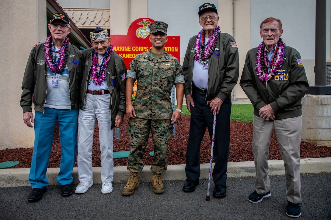 U.S. Marine Corps Col. Raul Lianez, commanding officer, Marine Corps Base Hawaii and U.S. Navy veterans pose for a group photo during the their visit, MCBH, Dec. 5, 2019. The Best Defense Foundation returned 6 WWII Pearl Harbor and Naval Air Station Kaneohe Bay survivors to Hawaii for the 78th Commemoration of Pearl Harbor and Naval Air Station Kaneohe Bay which is now MCBH. The heroes returned were Jack Holder US NAVY - Naval Air Station, Kaneohe Bay; Tom Foreman US Navy - USS Cushing; Ira Schab US Navy - USS Dobbin; Stuart Hedley US Navy - USS West Virginia; Donald Long US Navy - Naval Air Station, Kaneohe Bay; and Chuck Kohler US Navy - USS Hornet.