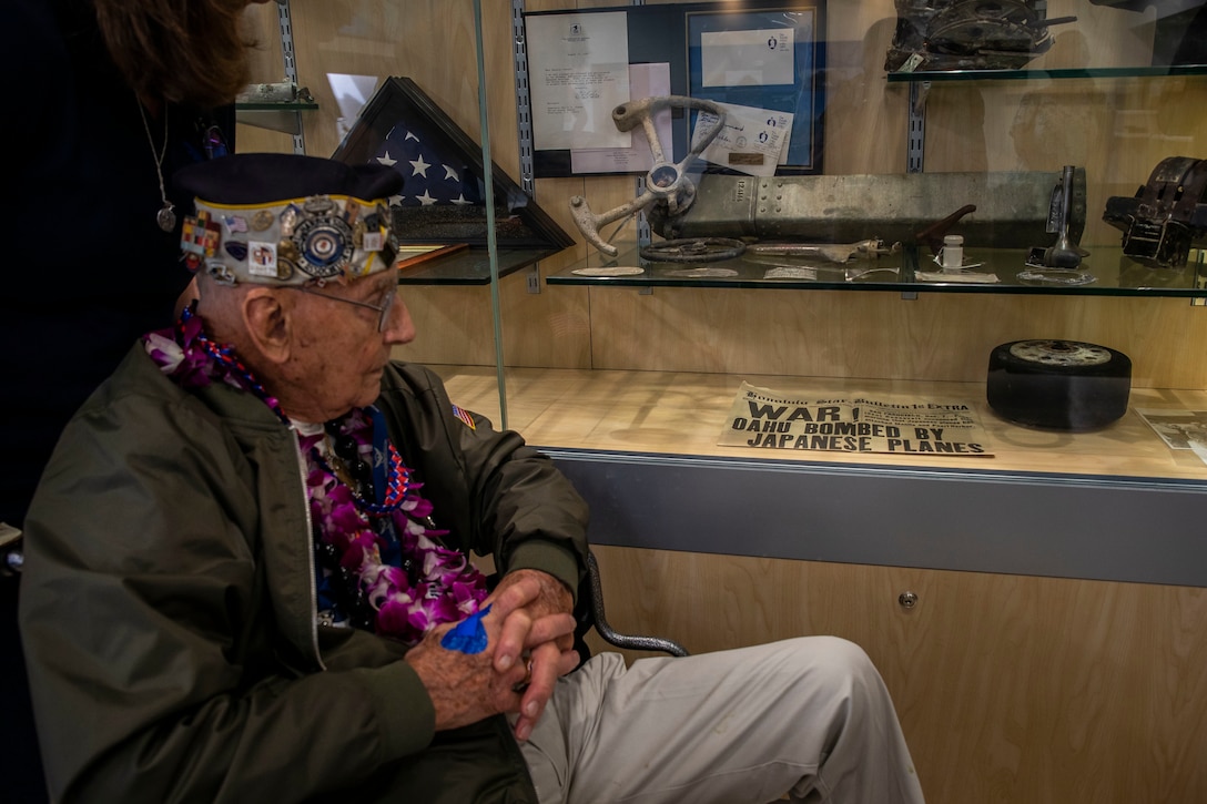 Stuart Hedley, retired U.S. Navy gun pointer, looks at a newspaper during his visit, Marine Corps Base Hawaii, Dec. 5, 2019. The Best Defense Foundation returned 6 WWII Pearl Harbor and Naval Air Station Kaneohe Bay survivors to Hawaii for the 78th Commemoration of Pearl Harbor and Naval Air Station Kaneohe Bay which is now MCBH. The heroes returned were Jack Holder US NAVY - Naval Air Station, Kaneohe Bay; Tom Foreman US Navy - USS Cushing; Ira Schab US Navy - USS Dobbin; Stuart Hedley US Navy - USS West Virginia; Donald Long US Navy - Naval Air Station, Kaneohe Bay; and Chuck Kohler US Navy - USS Hornet.