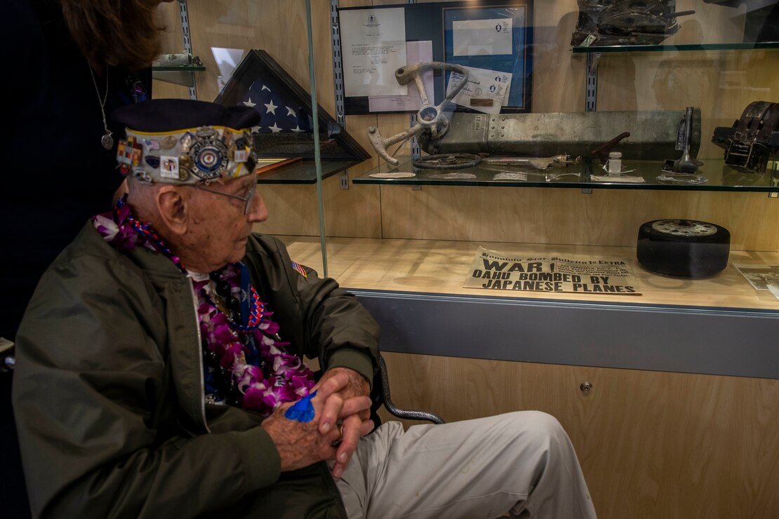 Stuart Hedley, retired U.S. Navy gun pointer, looks at a newspaper during his visit, Marine Corps Base Hawaii, Dec. 5, 2019. The Best Defense Foundation returned 6 WWII Pearl Harbor and Naval Air Station Kaneohe Bay survivors to Hawaii for the 78th Commemoration of Pearl Harbor and Naval Air Station Kaneohe Bay which is now MCBH. The heroes returned were Jack Holder US NAVY - Naval Air Station, Kaneohe Bay; Tom Foreman US Navy - USS Cushing; Ira Schab US Navy - USS Dobbin; Stuart Hedley US Navy - USS West Virginia; Donald Long US Navy - Naval Air Station, Kaneohe Bay; and Chuck Kohler US Navy - USS Hornet.
