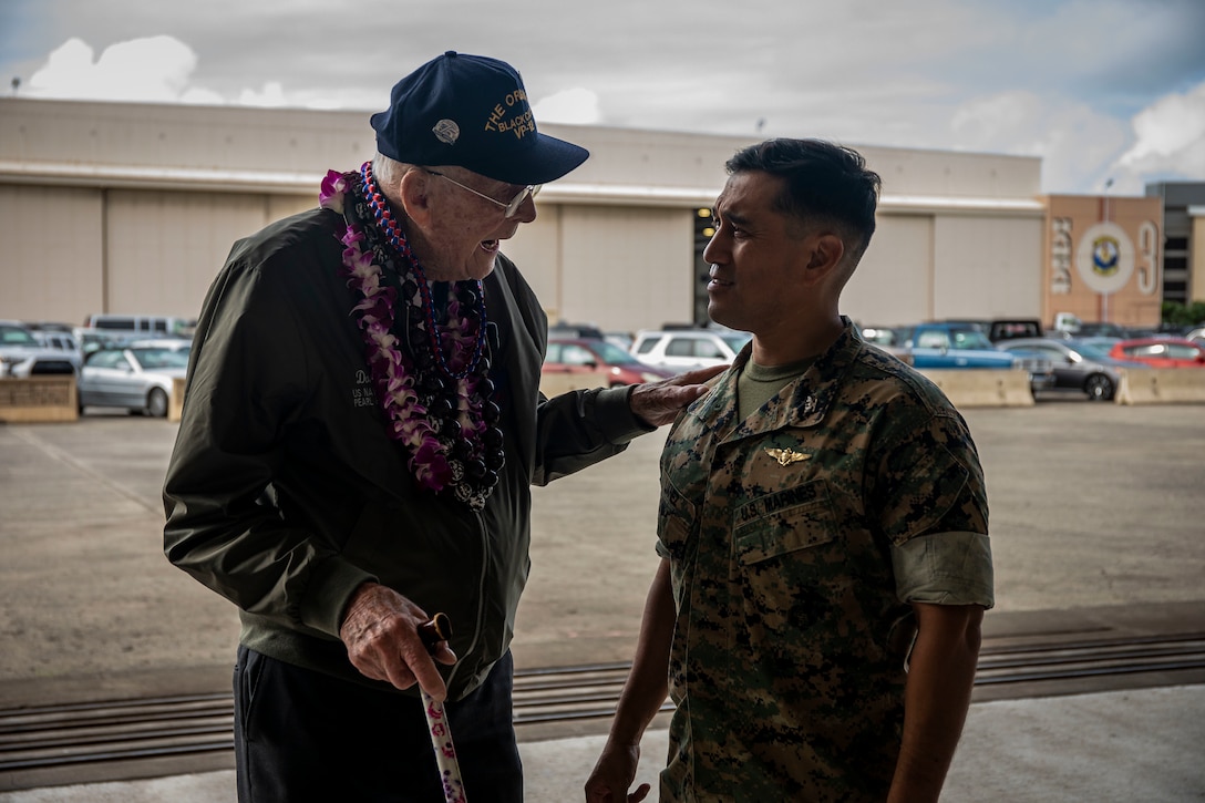 Donald Long, retired U.S. Navy radio operator, speaks with U.S. Marine Corps Col. Raul Lianez, commanding officer, Marine Corps Base Hawaii, during his visit, MCBH, Dec. 5, 2019. The Best Defense Foundation returned 6 WWII Pearl Harbor and Naval Air Station Kaneohe Bay survivors to Hawaii for the 78th Commemoration of Pearl Harbor and Naval Air Station Kaneohe Bay which is now MCBH. The heroes returned were Jack Holder US NAVY - Naval Air Station, Kaneohe Bay; Tom Foreman US Navy - USS Cushing; Ira Schab US Navy - USS Dobbin; Stuart Hedley US Navy - USS West Virginia; Donald Long US Navy - Naval Air Station, Kaneohe Bay; and Chuck Kohler US Navy - USS Hornet.