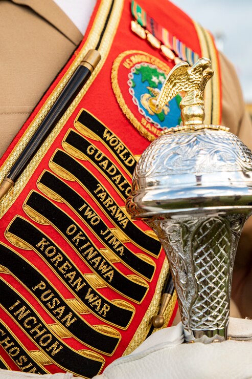 A U.S. Marine with the Marine Corps Forces, Pacific band, wields the mace during the annual Klipper Ceremony, Marine Corps Base Hawaii, Dec. 7, 2019. The Klipper Memorial was dedicated in 1981 to honor the 17 U.S. Navy Sailors and two civilian contractors who died during the attack on Naval Air Station Kaneohe Bay on Dec. 7, 1941.