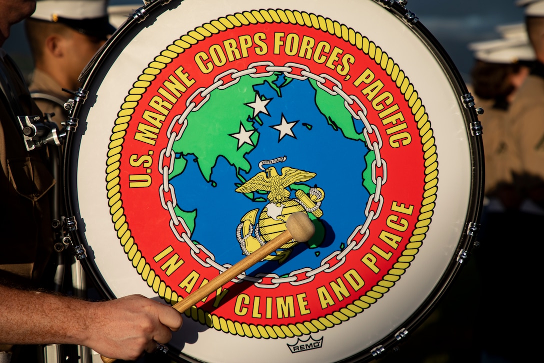 A U.S. Marine with the Marine Corps Forces, Pacific band, plays a drum adorned with the U.S. Marine Corps Forces, Pacific logo during the annual Klipper Ceremony, Marine Corps Base Hawaii, Dec. 7, 2019. The Klipper Memorial was dedicated in 1981 to honor the 17 U.S. Navy Sailors and two civilian contractors who died during the attack on Naval Air Station Kaneohe Bay on Dec. 7, 1941.