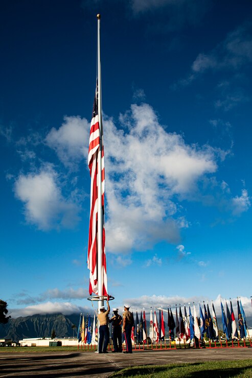 U.S. Marines with the Headquarters Battalion color guard hoist the colors during the annual Klipper Ceremony, Marine Corps Base Hawaii, Dec. 7, 2019. The Klipper Memorial was dedicated in 1981 to honor the 17 U.S. Navy Sailors and two civilian contractors who died during the attack on Naval Air Station Kaneohe Bay on Dec. 7, 1941.