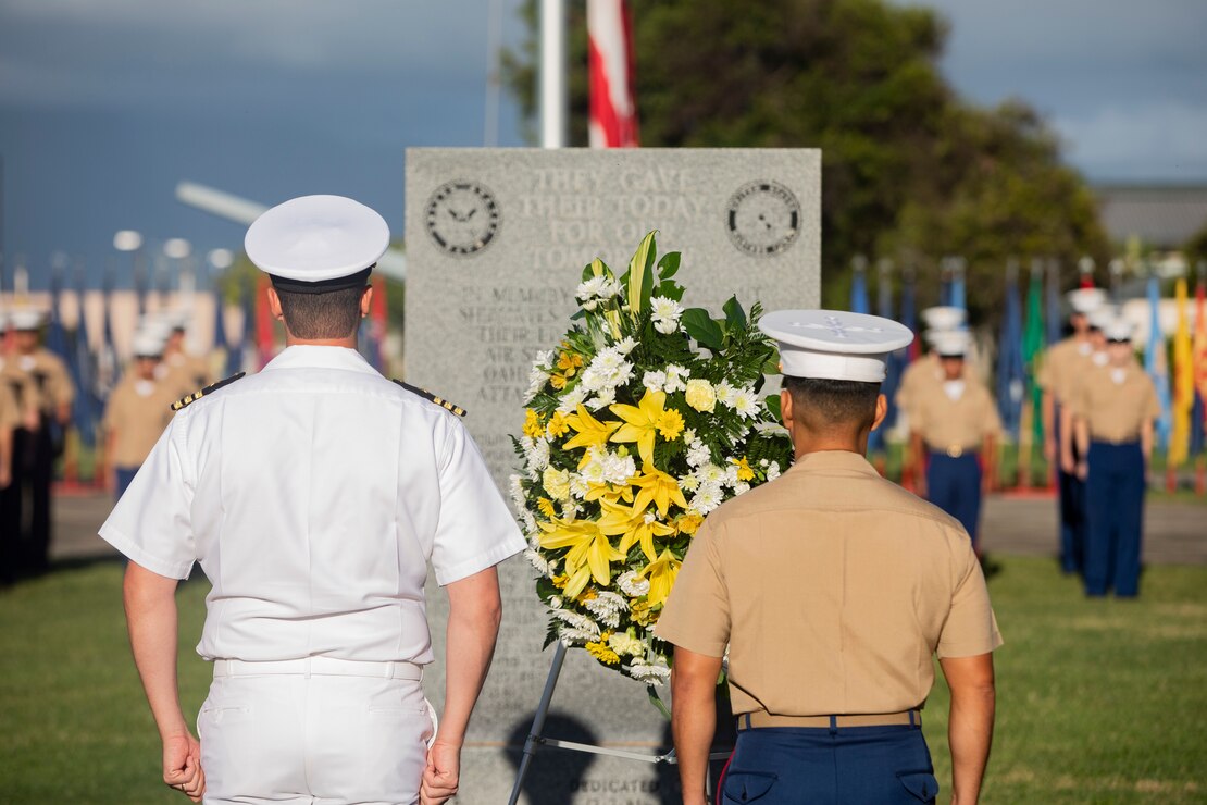 U.S. Marine Corps Col. Raul Lianez, commanding officer, Marine Corps Base Hawaii, places a wreath at the Klipper Memorial with CDR Steve Niemann, officer in charge, Naval Support Detachment, during the Klipper Ceremony, Marine Corps Base Hawaii, Dec. 7, 2019. The Klipper Memorial was dedicated in 1981 to honor the 17 U.S. Navy Sailors and two civilian contractors who died during the attack on Naval Air Station Kaneohe Bay on Dec. 7, 1941.