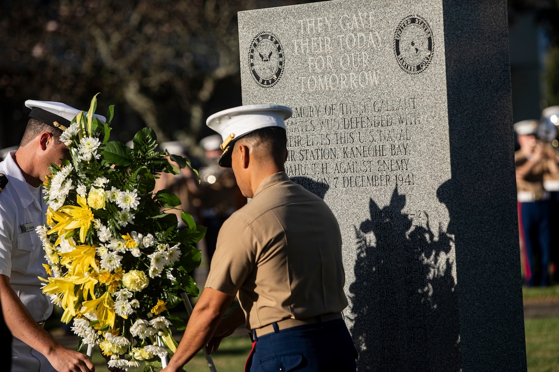 U.S. Marine Corps Col. Raul Lianez, commanding officer, Marine Corps Base Hawaii, places a wreath at the Klipper Memorial with CDR Steve Niemann, officer in charge, Naval Support Detachment, during the Klipper Ceremony, Marine Corps Base Hawaii, Dec. 7, 2019. The Klipper Memorial was dedicated in 1981 to honor the 17 U.S. Navy Sailors and two civilian contractors who died during the attack on Naval Air Station Kaneohe Bay on Dec. 7, 1941.