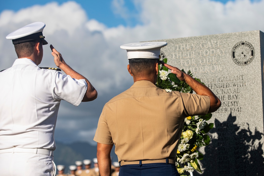 U.S. Marine Corps Col. Raul Lianez, commanding officer, Marine Corps Base Hawaii, and CDR Steve Niemann, officer in charge, Naval Support Detachment, place a wreath at the Klipper Memorial during the Klipper Ceremony, Marine Corps Base Hawaii, Dec. 7, 2019. The Klipper Memorial was dedicated in 1981 to honor the 17 U.S. Navy Sailors and two civilian contractors who died during the attack on Naval Air Station Kaneohe Bay on Dec. 7, 1941.