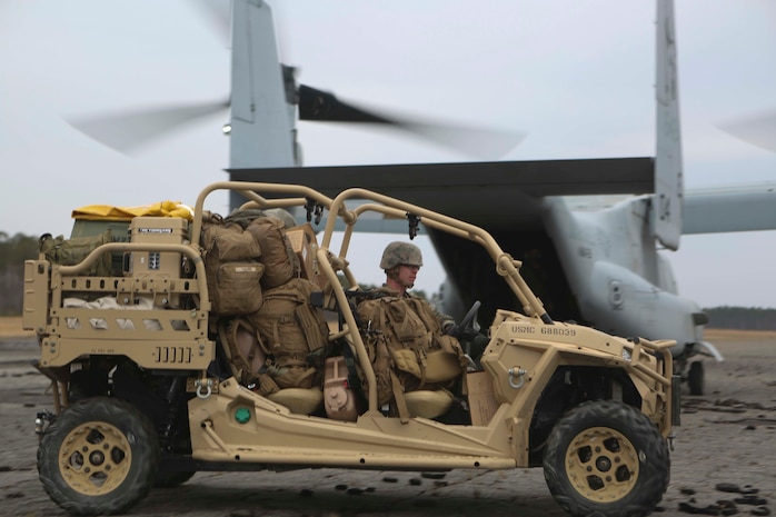Marines unload a Utility Task Vehicle from an MV-22B Osprey on Camp Lejeune, North Carolina, Feb. 19, 2019. The UTV increased mobility and load bearing capacity for the Marines during an airfield occupation exercise. Program Executive Officer Land System’s Light Tactical Vehicle program office is currently implementing several upgrades—including upgraded tires, clutch improvement kit and floorboard protection—to UTVs across the fleet. (U.S. Marine Corps photo by Lance Cpl. Camila Melendez)