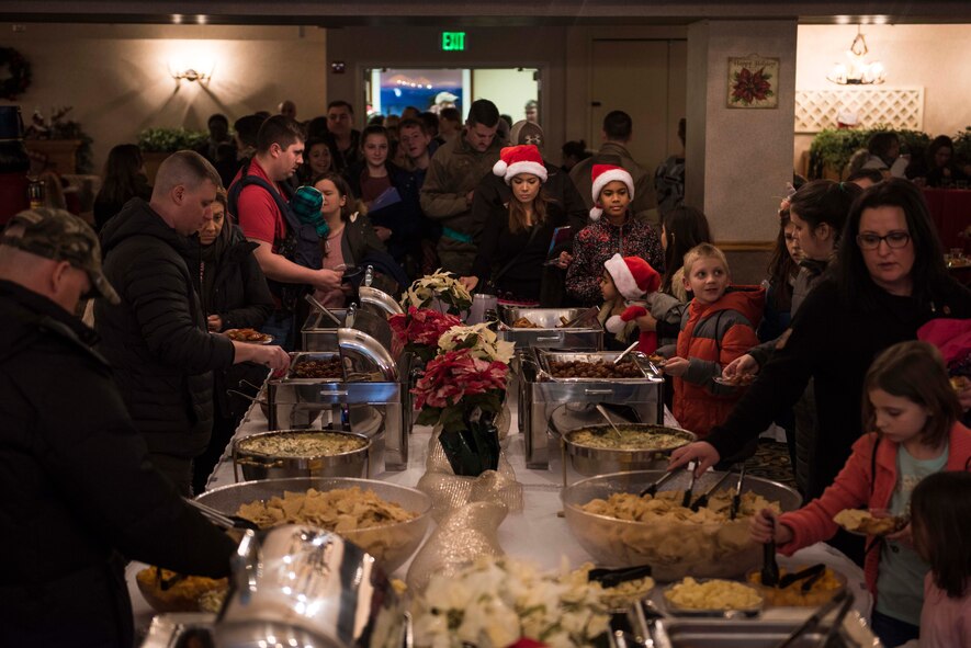 Families gather during Eielson’s Winter Festival at the Yukon Club on Eielson Air Force Base, Alaska, Dec. 6, 2019. The event consisted of games, free food, a photo booth, and prize giveaways in celebration of the holiday season. (U.S. Air Force photo by Airman 1st Class Aaron Larue Guerrisky)