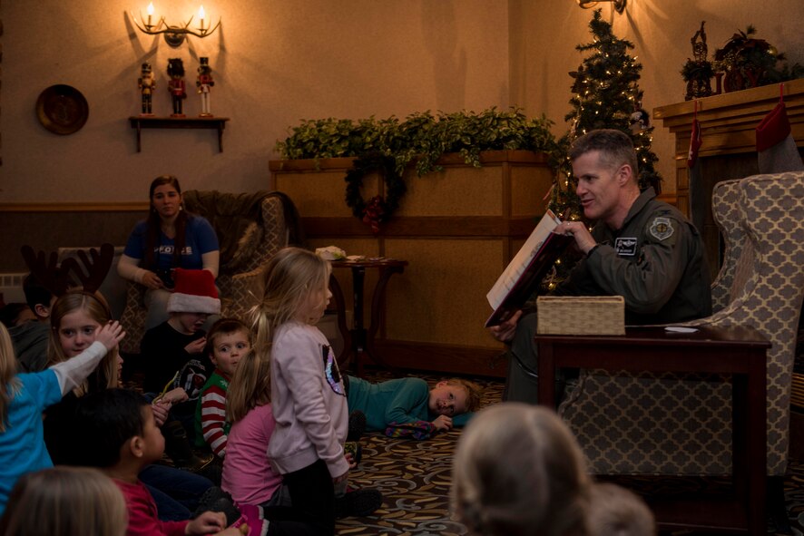 U.S. Air Force Col. Benjamin Bishop, 354th Fighter Wing commander, reads during Eielson’s Winter Festival at the Yukon Club on Eielson Air Force Base, Alaska, Dec. 6, 2019. The Winter Festival concluded with Bishop reading “The Night Before Christmas” to children in attendance. (U.S. Air Force photo by Airman 1st Class Aaron Larue Guerrisky)