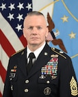 U.S. Army Command Sgt. Maj. John Wayne Troxell, senior enlisted advisor to the chairman of the Joint Chiefs of Staff, poses for his official portrait with the new SEAC rank insignia in the Army portrait studio at the Pentagon in Arlington, Va., Dec. 9, 2019.
