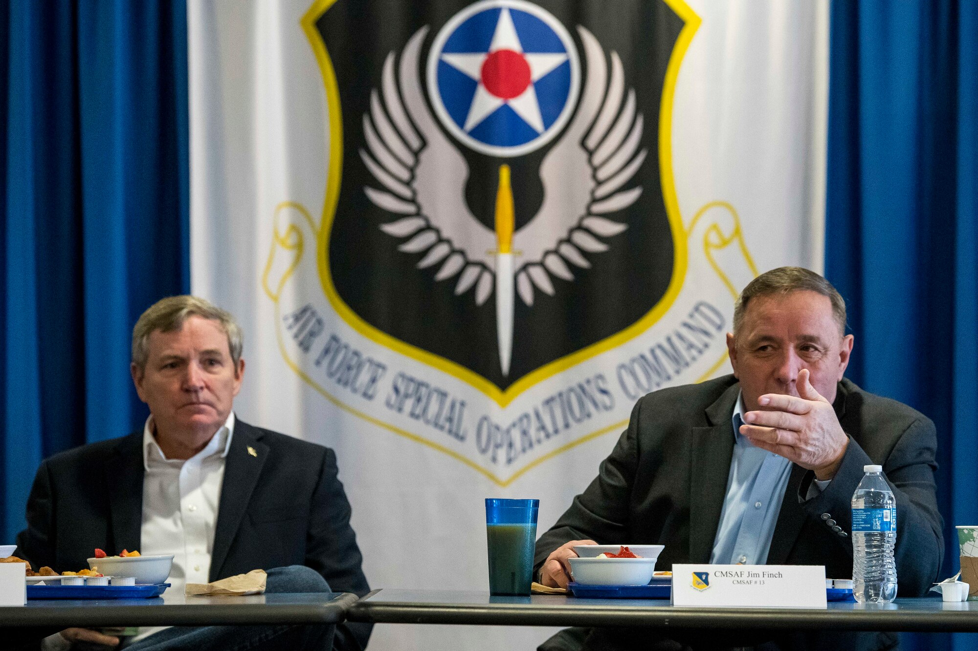 Retired Chief Master Sgts. of the Air Force Eric W. Benken and Jim Finch give speeches during a breakfast with senior leadership at Cannon Air Force Base, N.M., Dec. 5, 2019. The 12th and 13th Chief Master Sgts. of the Air Force visited Cannon to share their stories with Air Commandos. (U.S. Air Force photo Senior Airman Vernon R. Walter)