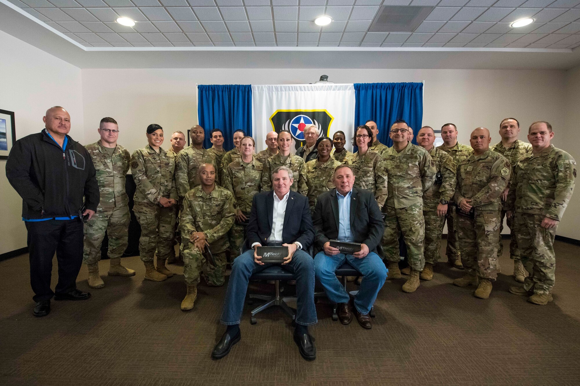 Retired Chief Master Sgts. of the Air Force Eric W. Benken and Jim Finch pose for a photo with senior leadership at Cannon Air Force Base, N.M., Dec. 5, 2019. The 12th and 13th Chief Master Sgts. of the Air Force visited Cannon to share their stories with Air Commandos. (U.S. Air Force photo Senior Airman Vernon R. Walter)