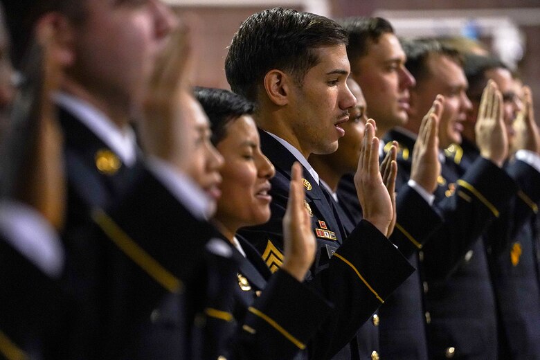 Army Sgt. Franco Leon, assigned to the 539th Composite Truck Company (Light), 17th Combat Sustainment Support Battalion, U.S. Army Alaska, recites the noncommissioned officer creed during an NCO induction ceremony at the Alaska Army National Guard armory on Joint Base Elmendorf-Richardson, Alaska, Dec. 6, 2019, as he and his fellow Soldiers make the career transition into junior leaders, and are promoted to the rank of sergeant. When Army Soldiers are promoted to the noncommissioned officer ranks they become the first level of authority in their Soldiers' chains of command, and are responsible for their charges' health, welfare, training and discipline.