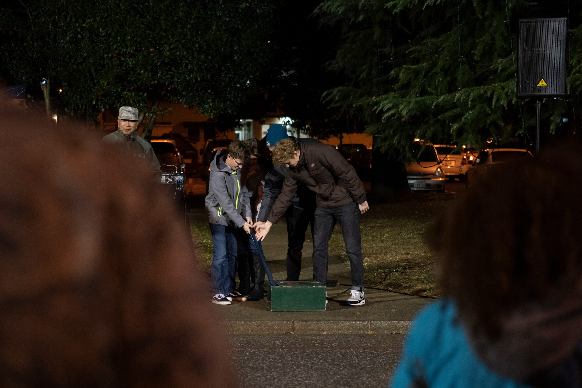 The Family of a deployed service member light up the base Christmas tree on Dec. 6, 2019, at Yokota Air Base, Japan.