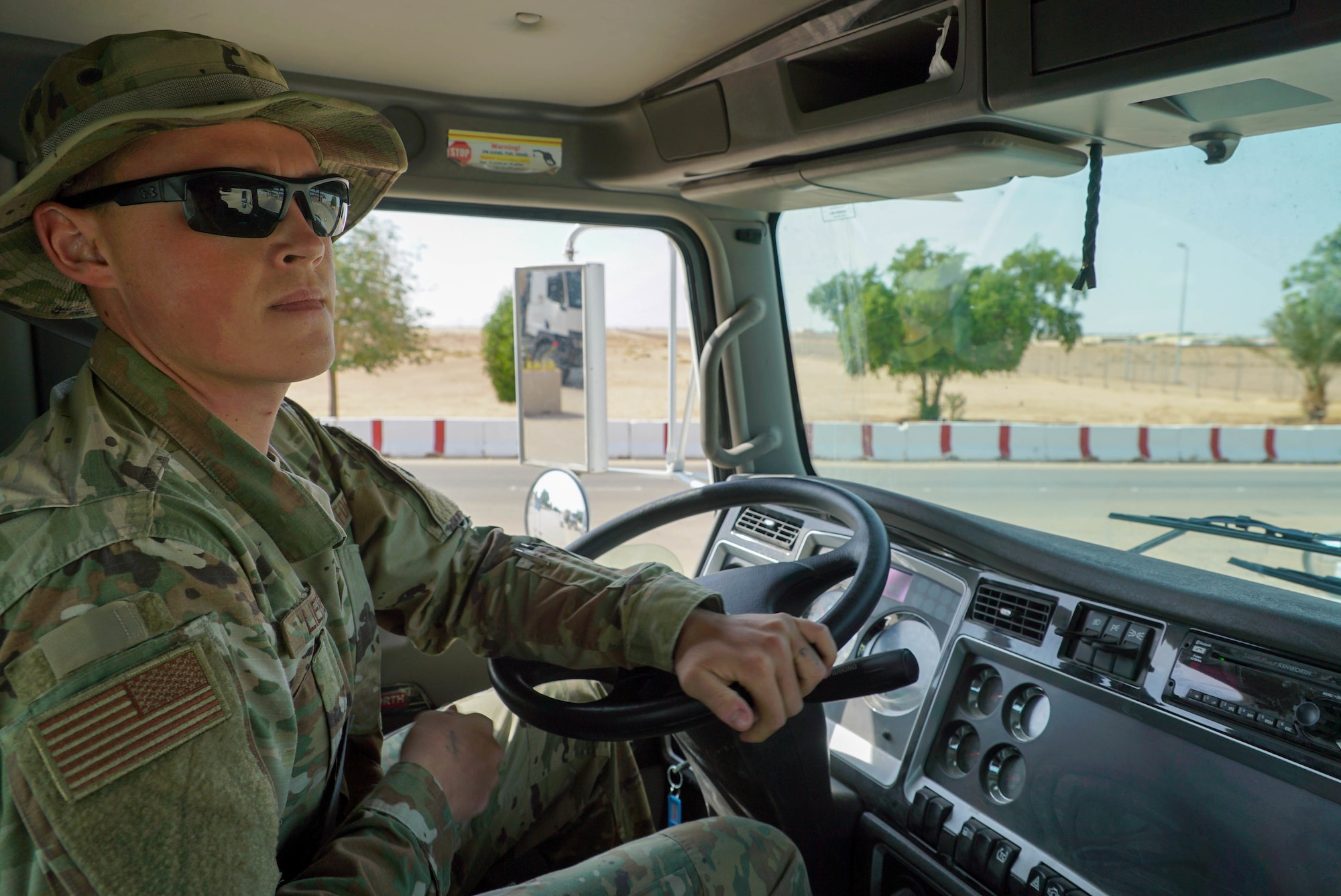 U.S. Air Force Senior Airman Nathaniel Liebe, a vehicle operator from the 378th Expeditionary Logistics Readiness Squadron, navigates through a gate to pick up new Airmen on Prince Sultan Air Base (PSAB), Saudi Arabia, Nov. 26, 2019.