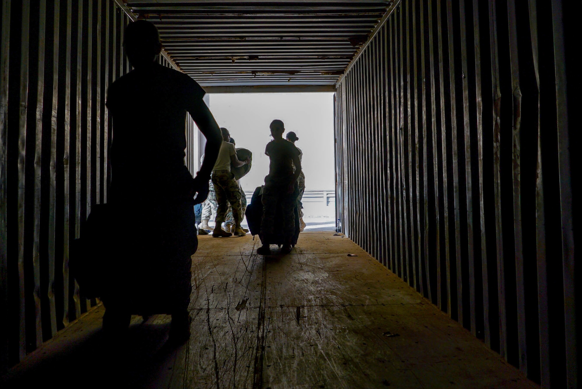 U.S. Airmen begin the process of loading deployed members baggage onto a truck on Prince Sultan Air Base (PSAB), Saudi Arabia, Nov. 26, 2019.