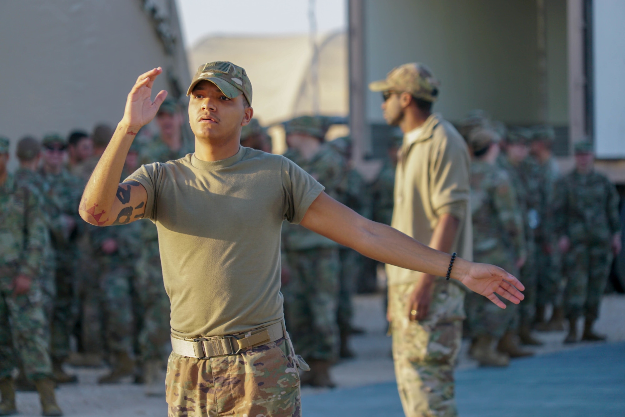 U.S. Air Force Senior Airman Malik Anderson, a vehicle operator from the 378th Expeditionary Logistics Readiness Squadron, directs a truck full of luggage on Prince Sultan Air Base (PSAB), Saudi Arabia, Nov. 26, 2019.