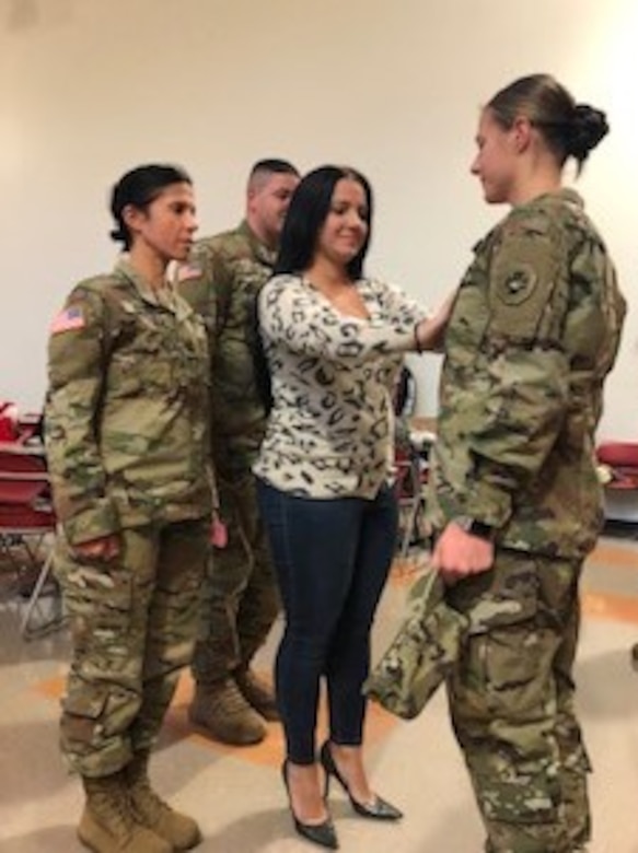 The Army Non-commissioned Officer Corps gained another leader when Sgt. Dana Valenia, a 68C, Licensed Practical Nurse, was promoted in front of Family and fellow 865th Combat Support Hospital Soldiers, Dec. 8, 2019.