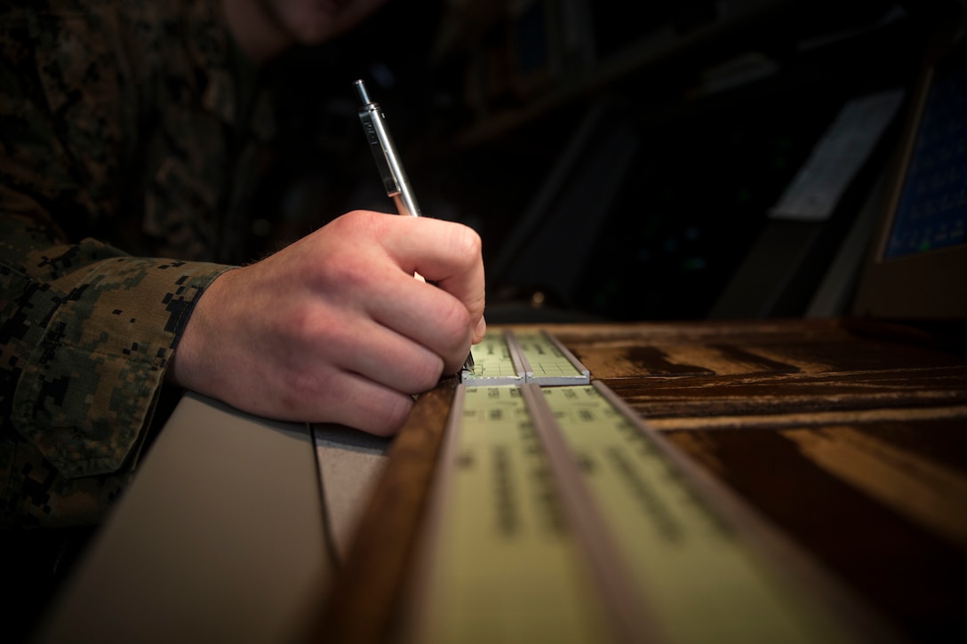 Cpl. Jacob Lenling sits in the radar room of the air traffic control tower aboard Marine Corps Air Station Beaufort, Dec. 4. Lenling is an air traffic controller with Headquarters and Headquarters Squadron. In honor of International Volunteer Day, Lenling is being recognized for having more than 431 volunteer hours.