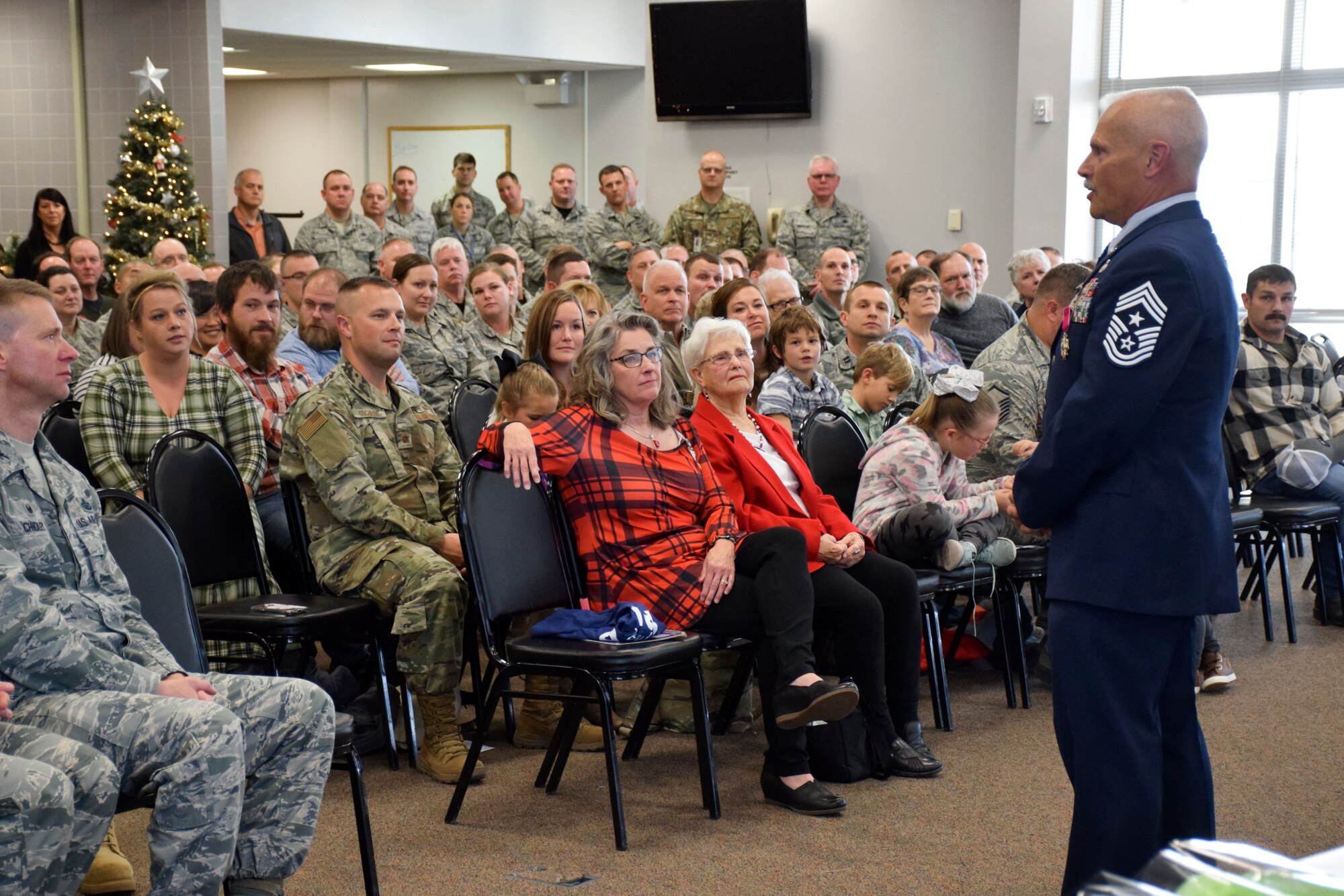 Former Command Chief Master (CCM) Sgt. Timothy E. Cochran speaks during his retirement ceremony held in the Dining Facility at the 132d Wing in Des Moines, Iowa on Saturday, December 7, 2019.  Cochran is the 6th CCM of Iowa; his successor, CCM Thomas (T.J.) Fennell assumed responsibility in November.  (Air National Guard photo by Tech. Sgt. Linda K. Burger/Released)