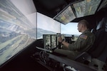 Capt. Tristan Stonger, a pilot from the Kentucky Air National Guard’s 165th Airlift Squadron, uses a C-130 simulator for training at the Kentucky Air National Guard Base in Louisville, Ky., Aug. 28, 2019. Known as the Multi-Mission Crew Trainer, the system helps prepare Airmen for handling in-flight emergencies.