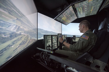 Capt. Tristan Stonger, a pilot from the Kentucky Air National Guard’s 165th Airlift Squadron, uses a C-130 simulator for training at the Kentucky Air National Guard Base in Louisville, Ky., Aug. 28, 2019. Known as the Multi-Mission Crew Trainer, the system helps prepare Airmen for handling in-flight emergencies.