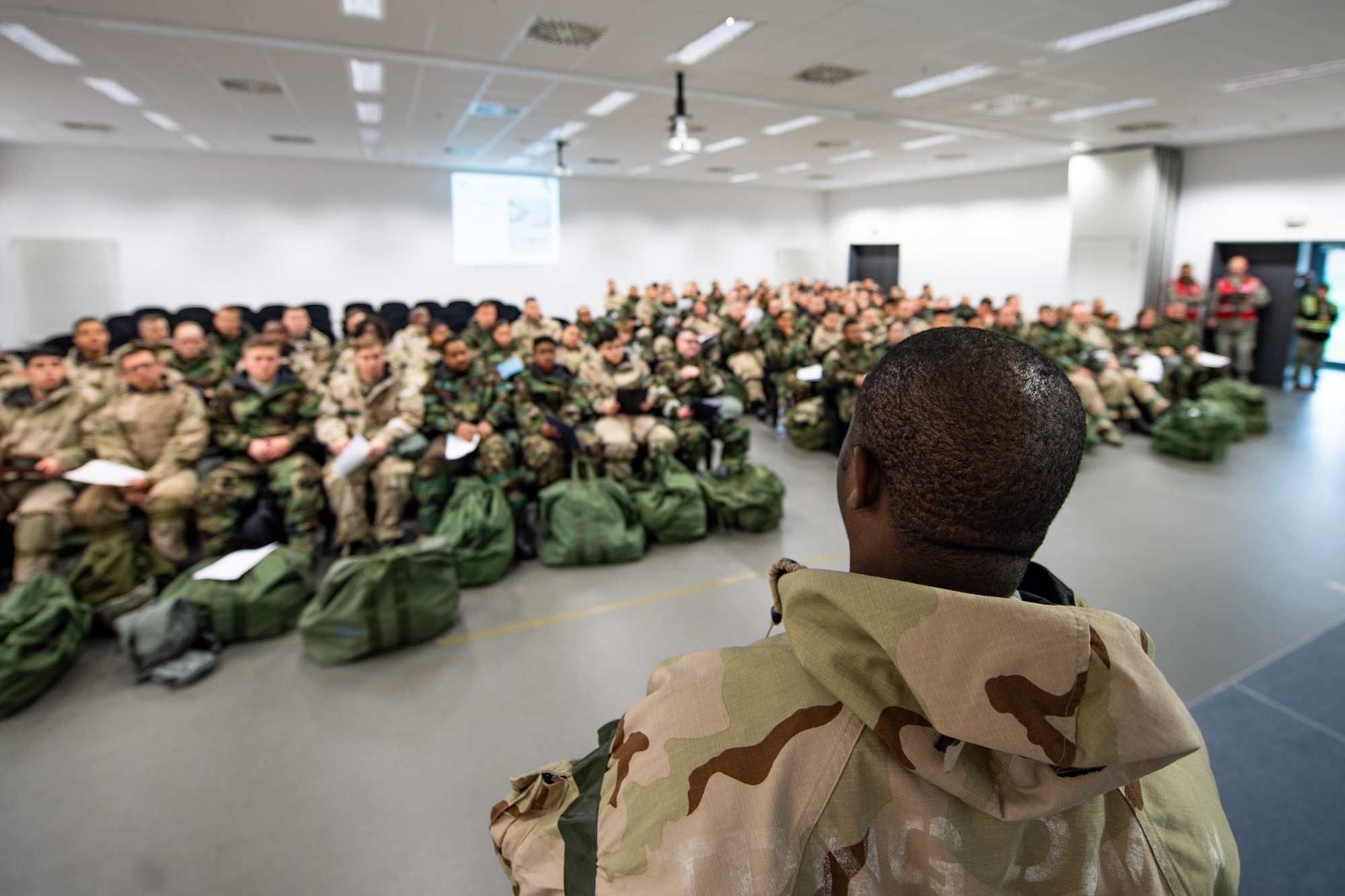 U.S. Air Force Tech. Sgt. Dave Looby, 86th Airlift Wing occupational safety officer, gives a briefing to Airmen during exercise Operation Varsity 19-04 at Ramstein Air Base, Germany, Dec. 9, 2019. Looby explained the unique safety hazards to the local area. (U.S. Air Force photo by Staff Sgt. Devin Boyer)