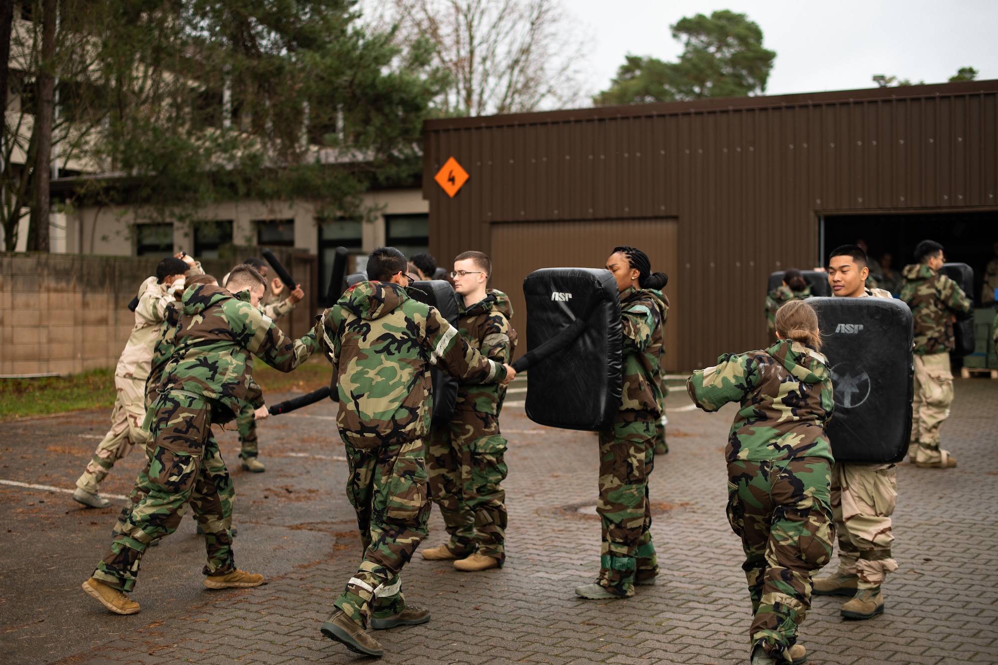U.S. Air Force Airmen assigned to the 86th Security Forces Squadron perform combat training during exercise Operation Varsity 19-04, at Ramstein Air Base, Germany, Dec. 9, 2019. The security forces Airmen wore Mission-Oriented Protective Posture gear while training to familiarize themselves chemical attack procedures. (U.S. Air Force photo by Staff Sgt. Devin Boyer)