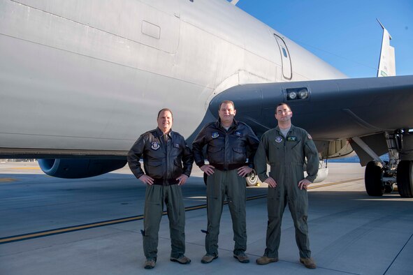 U.S. Air Force Lt. Col. Doug Miller and Lt. Col. Joe Smarsh, 77th Air Refueling Squadron pilots, pose for a photo with Master Sgt. Brian Greer, a 77 ARS boom operator, on the flightline at Seymour Johnson Air Force Base, North Carolina, Dec. 5, 2019.