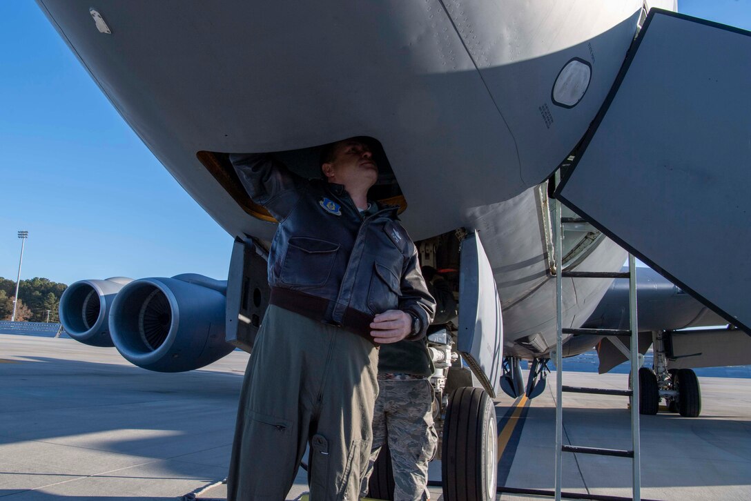 U.S. Air Force Lt. Col. Joe Smarsh, a 77th Air Refueling Squadron pilot, completes pre-flight checks on a KC-135 Stratotanker on the flightline at Seymour Johnson Air Force Base, North Carolina, Dec. 5, 2019.