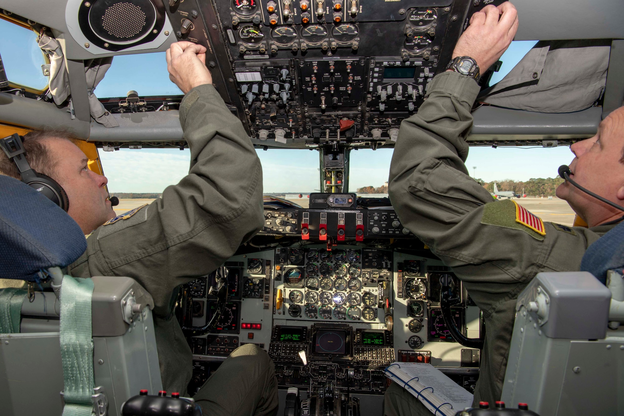 U.S. Air Force Lt. Col. Doug Miller and Lt. Col. Joe Smarsh, 77th Air Refueling Squadron pilots, complete pre-flight checks in the cockpit of a KC-135 Stratotanker on the flightline at Seymour Johnson Air Force Base, North Carolina, Dec. 5, 2019.