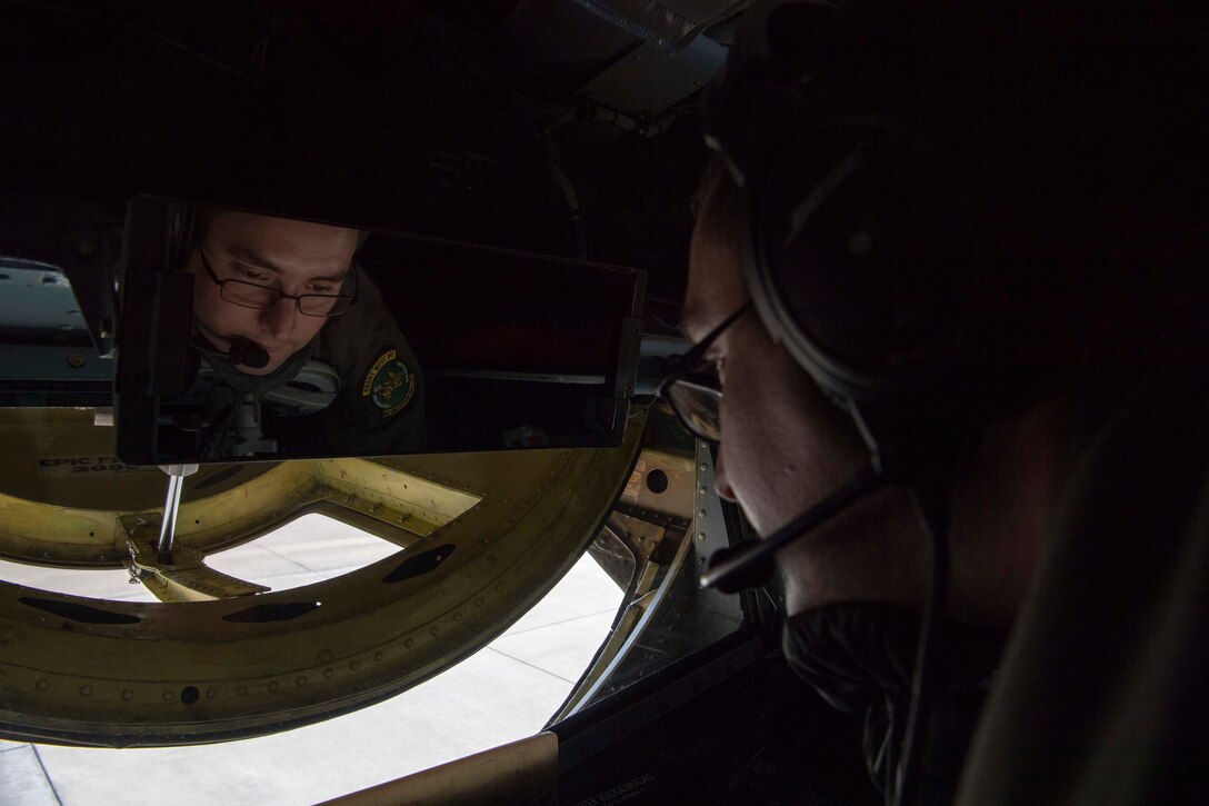 U.S. Air Force Master Sgt. Brian Greer, a 77 ARS boom operator, opens the boom window on a KC-135 Stratotanker before takeoff from the flightline on Seymour Johnson Air Force Base, North Carolina, Dec. 5, 2019.