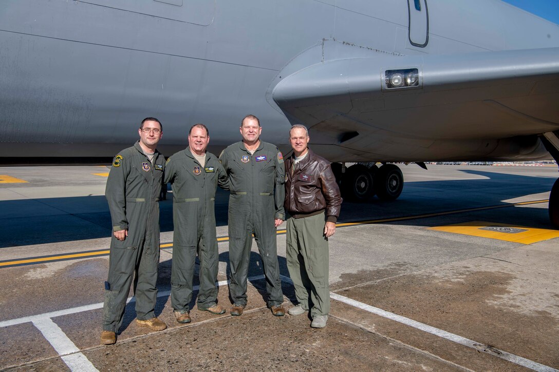 U.S. Air Force Lt. Col. Doug Miller and Lt. Col. Joe Smarsh, 77th Air Refueling Squadron pilots, along with Master Sgt. Brian Greer, a 77 ARS boom operator, pose with Col. Stephen “Steve” Lanier, the incoming 916th Air Refueling Wing Commander on the flightline at Seymour Johnson Air Force Base, North Carolina, Dec. 5, 2019.