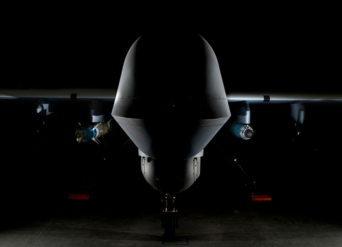 An MQ-9 Reaper is loaded with a GBU-12 laser-guided bomb on the left and a GBU-38 Joint Direct Attack Munition on the right April 13, 2017, at Creech Air Force Base, Nevada. The JDAM is a GPS guided munition which brings added capability to the warfighters, specifically by aircrews being able to employ weapons through inclement weather. The first two GBU-38s employed in training successfully hit their targets May 1, 2017, over the Nevada Test and Training Range. (U.S. Air Force photo by Senior Airman Christian Clausen)