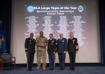 Five men pose with a group award during the Dec. 6 DLA Employee Recognition Awards Ceremony.