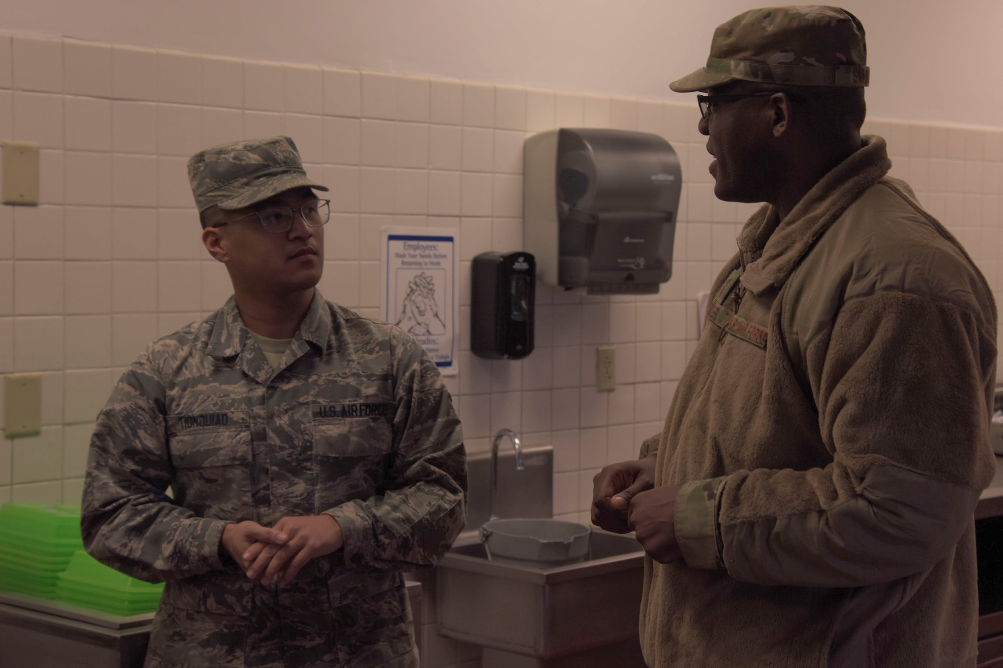 U.S. Air Force Chief Master Sgt. Wendell Snider, 366th Fighter Wing command chief talks to Airman 1st Class Rojanne Tionquiano, 366th Force Support Squadron, food service journeyman, November 1, 2019, on Mountain Home Air Force Base, Idaho. Tionquiano was recognized as gunfighter of the week. (U.S. Air Force photo by Airman 1st Class Nicholas Swift)