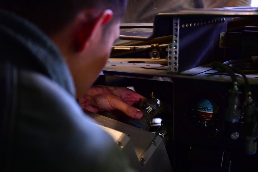 A man works on stuff.