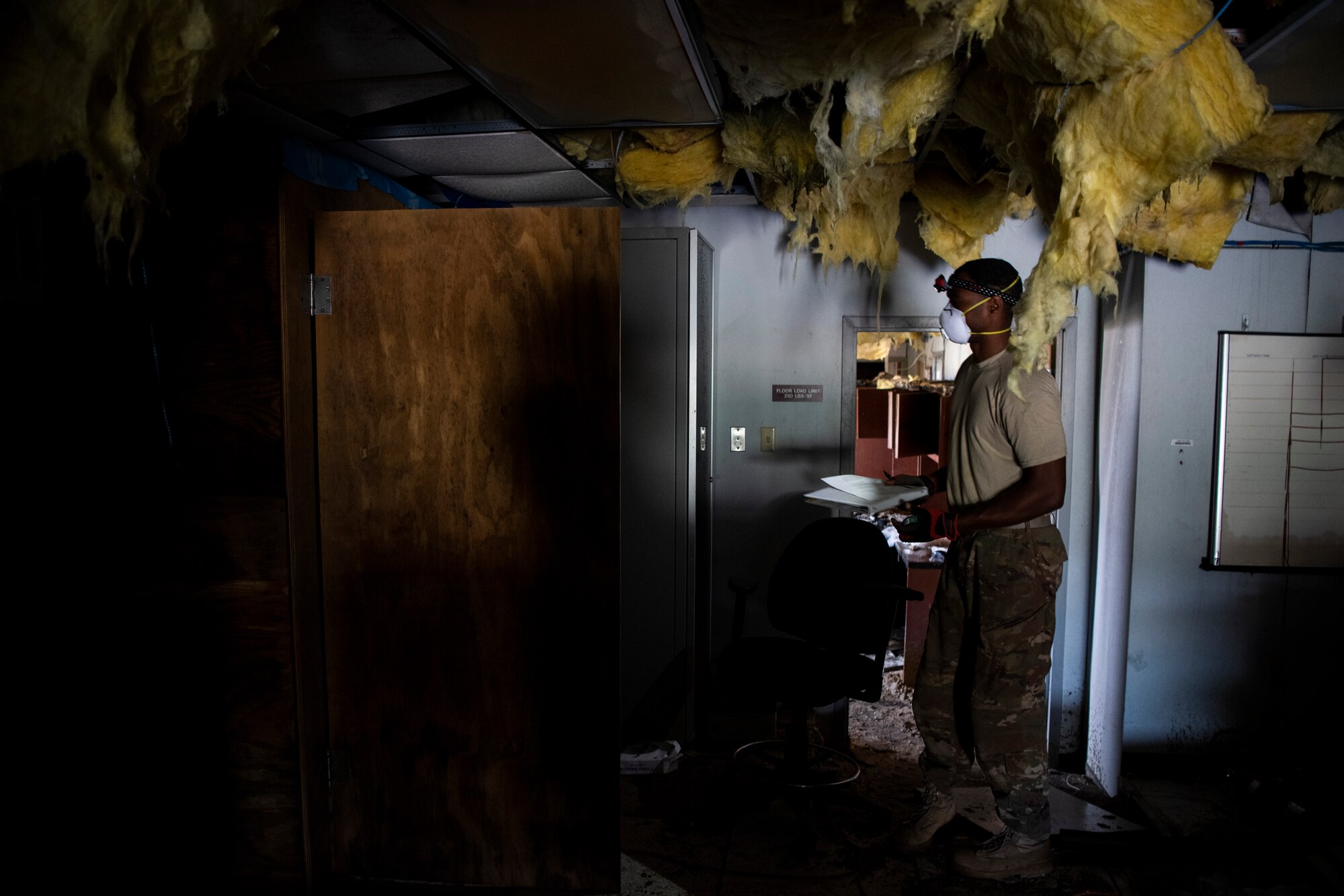 U.S. Air Force Tech. Sgt. Samuale Bailey, 85th Engineering Installation Squadron cable antenna maintenance technician, heads towards a network node at Tyndall Air Force Base, Florida, Dec. 9, 2019. Bailey is part of a team working with the 325th Communications Squadron to relocate a node from a building that was damaged by Hurricane Michael. (U.S. Air Force photo by Tech. Sgt. Clayton Lenhardt)