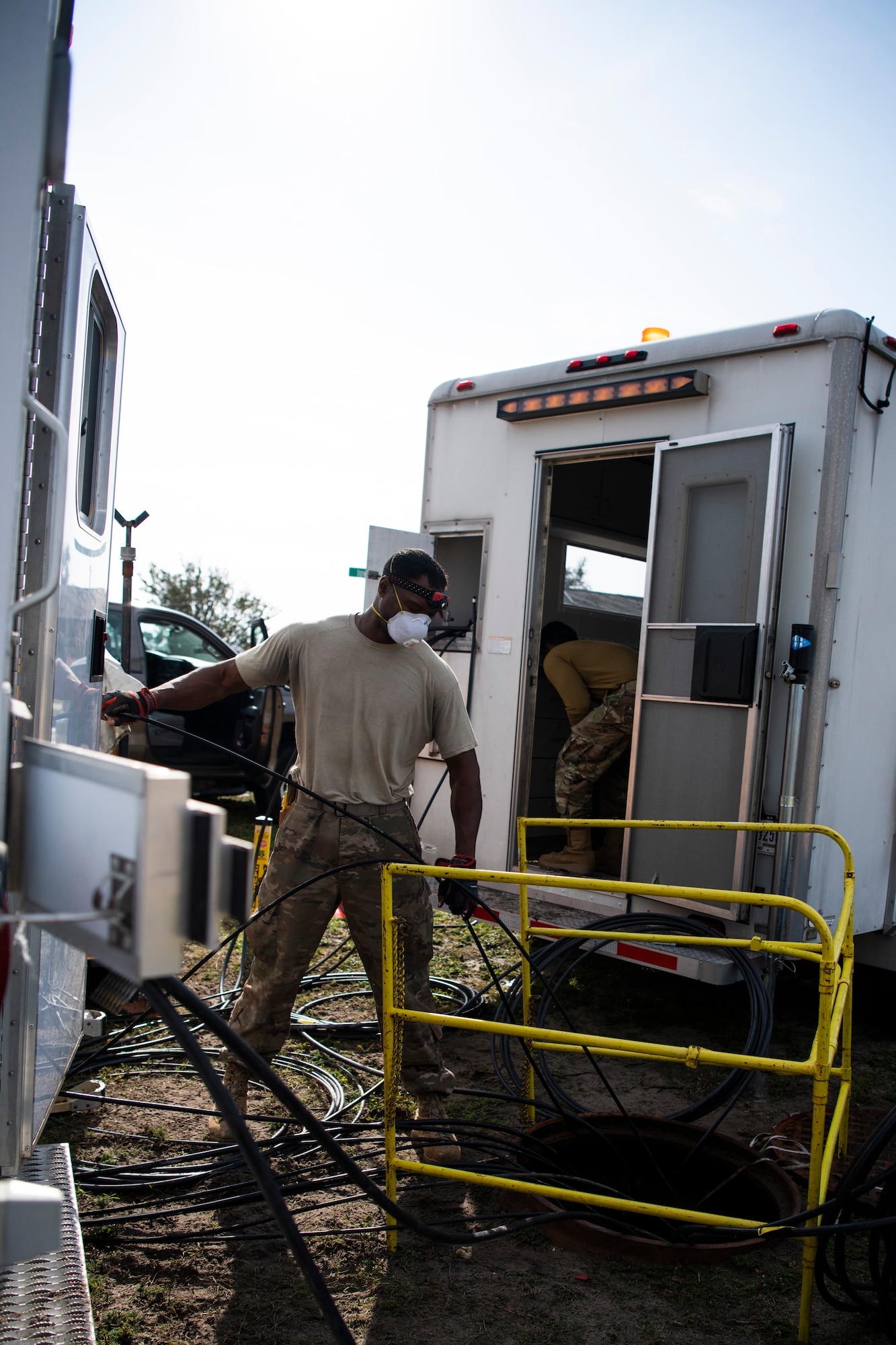 U.S. Air Force Tech. Sgt. Samuale Bailey, 85th Engineering Installation Squadron cable antenna maintenance technician, collects old cabling at Tyndall Air Force Base, Florida, Dec. 9, 2019. Bailey is part of a team from Keesler Air Force Base working with the 325th Communications Squadron to relocate a core network node. (U.S. Air Force photo by Tech. Sgt. Clayton Lenhardt)