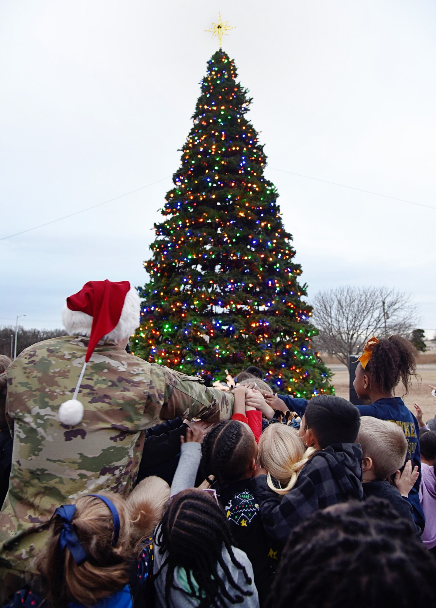 An image of 72nd Air Base Wing Commander Col. Paul Filcek at Tinker's tree lighting and holiday parade.