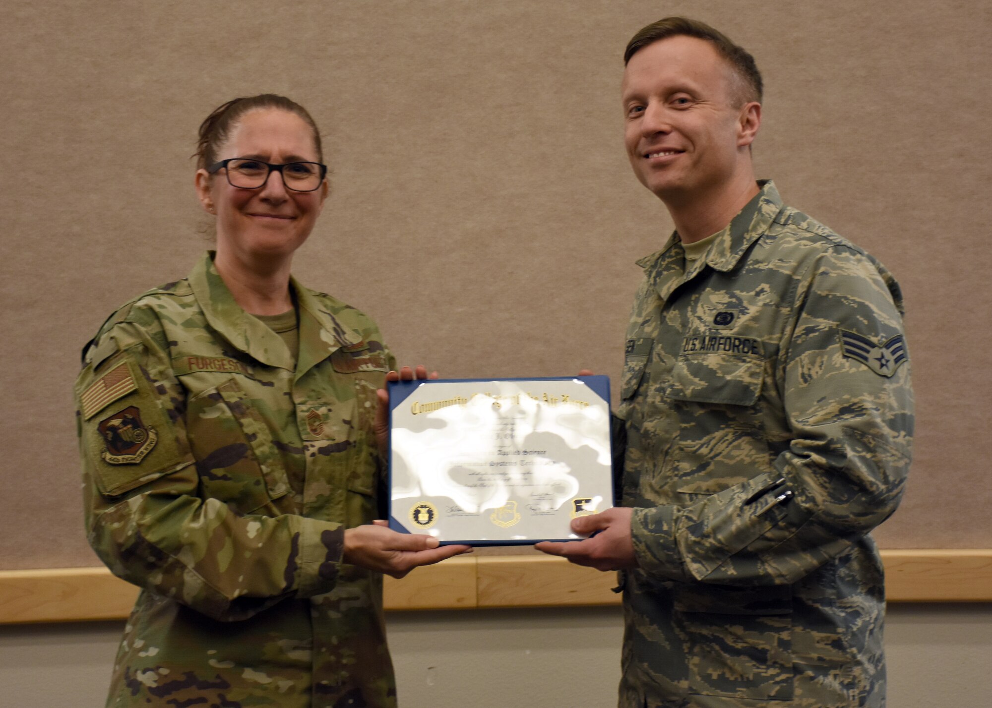 Senior Airman Eric Oslen receives an Associates Degree in Information Systems Technology at Whiteman Air Force Base, Mo., Dec. 8, 2019.