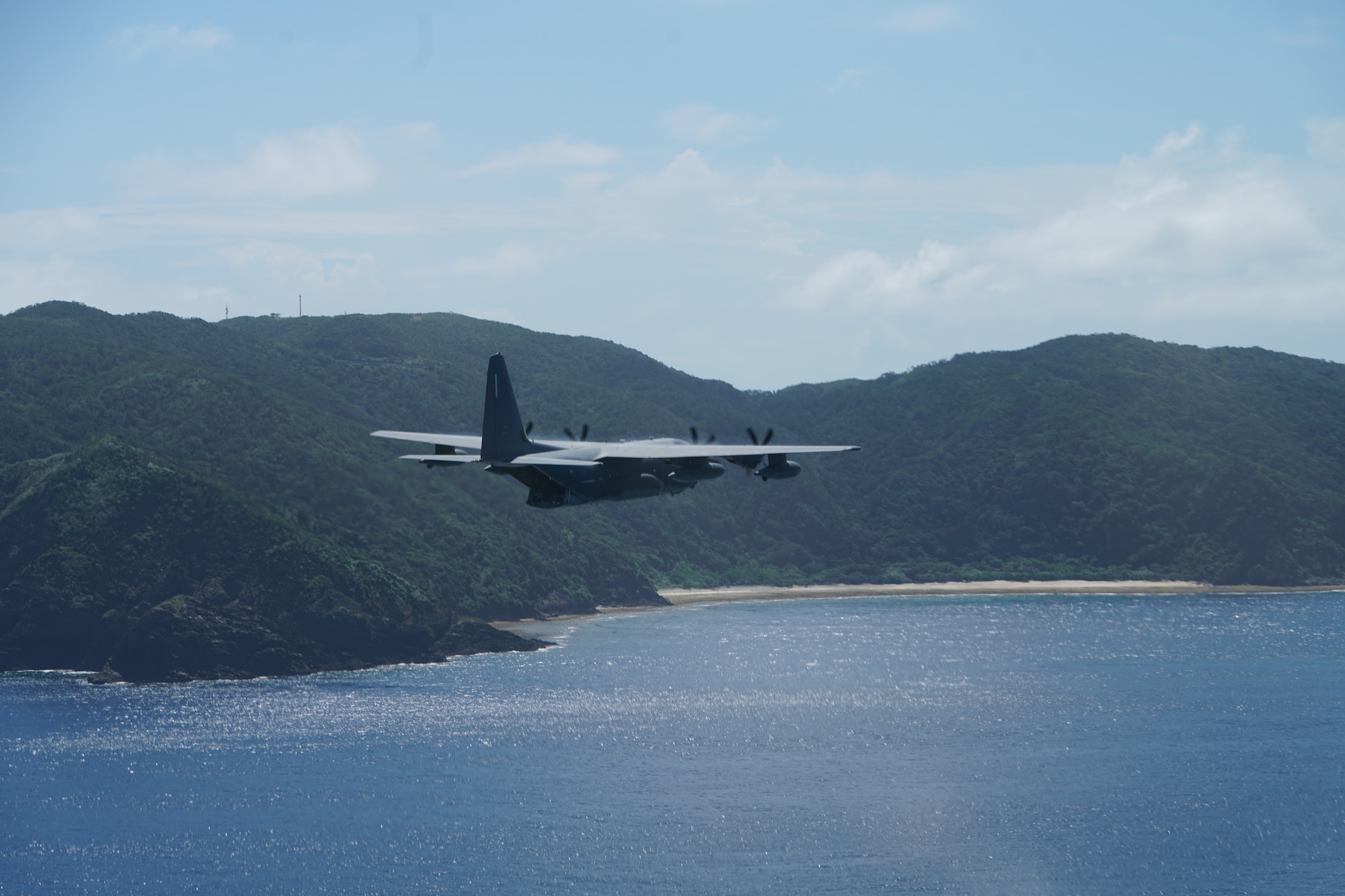 A U.S. Air Force C-130 assigned to the 353rd Special Operations Group flies over Okinawa, Japan 27 September, 2019.