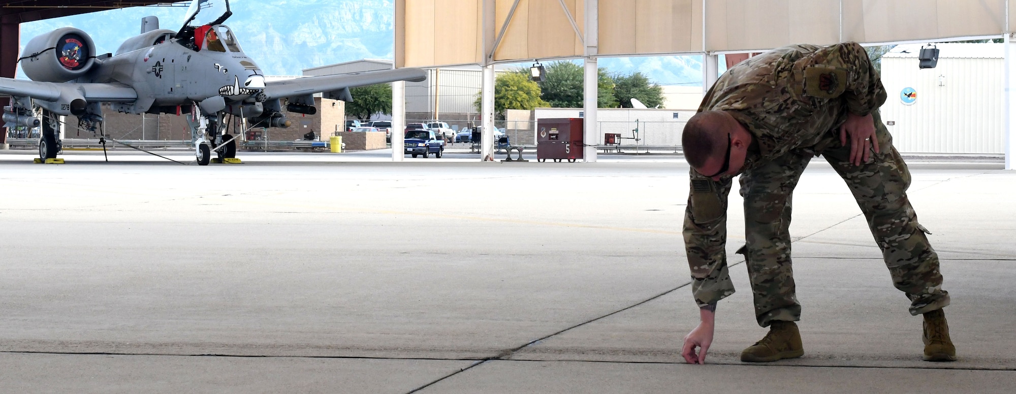 Photo of FOD manager removing a rock