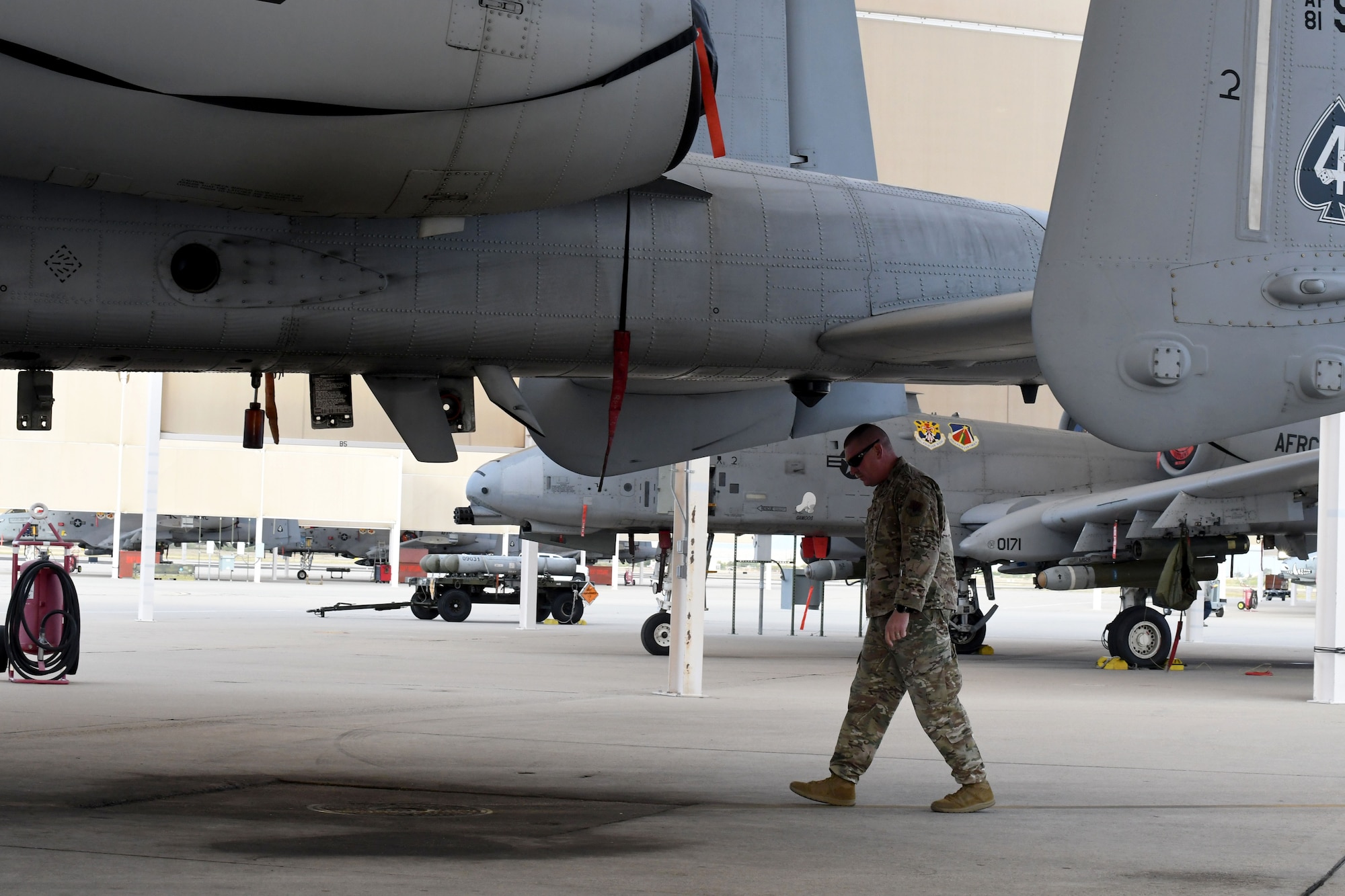 Photo of FOD manager under an A-10