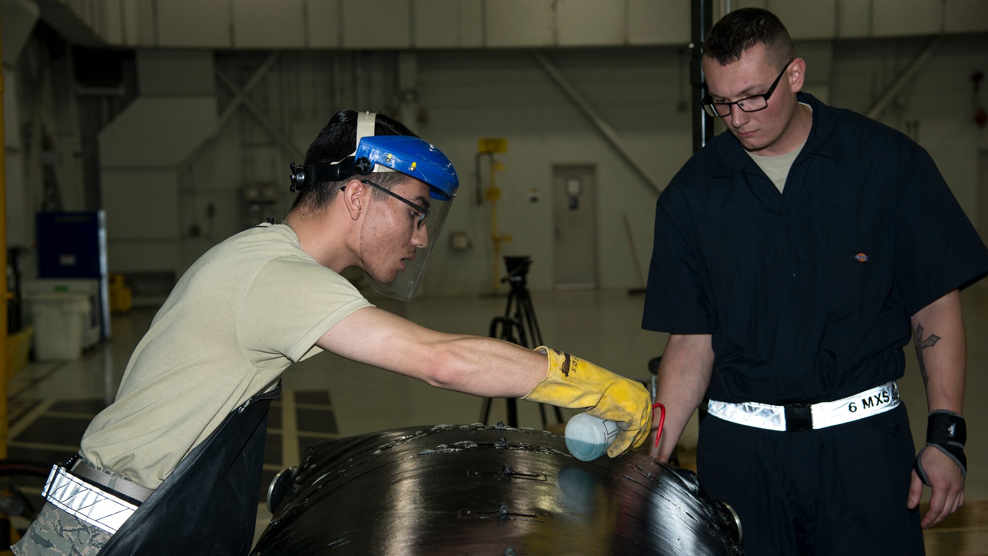 U.S. Air Force Airman 1st Class Luis Garcia-Munoz, a 6th Maintenance Squadron (MXS) fuels system apprentice, and Staff Sgt. Dakota Williamson, a 6th MXS fuels system craftsman, test a fuel cell bladder for leaks at MacDill Air Force Base, Fla., Nov. 25, 2019.