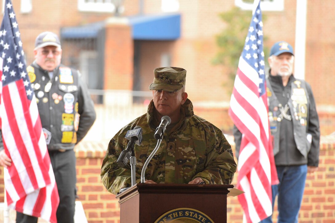 Maj. Gen. Michael Berry, Delaware Army National Guard adjutant general, speaks during a Wreaths Across America (WAA) event held in Dover, Del., Dec. 9, 2019. During the Dover WAA event, many local and military leaders spoke before joining children from a local elementary school to place wreaths at each of the memorials located around Legislative Mall. The annual WAA event is held at more than 1,600 locations, where volunteers lay wreaths at memorials and cemeteries in honor of those who served. The wreaths are symbolic: the evergreens represent longevity and endurance, the red bow represents great sacrifice, and the circular shape represents eternity. (U.S. Air Force photo by Senior Airman Eric M. Fisher)