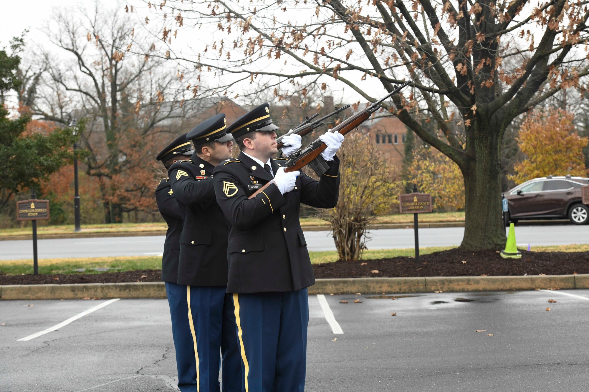 Delaware Army National Guard Color Guard fires a volley salute during the Wreaths Across America (WAA) event in Dover, Del., Dec. 9, 2019. During the Dover WAA event, many local and military leaders spoke before joining children from a local elementary school to place wreaths at each of the memorials located around Legislative Mall. The annual WAA event is held at more than 1,600 locations, where volunteers lay wreaths at memorials and cemeteries in honor of those who served. The wreaths are symbolic: the evergreens represent longevity and endurance, the red bow represents great sacrifice, and the circular shape represents eternity. (U.S. Air Force photo by Senior Airman Eric M. Fisher)