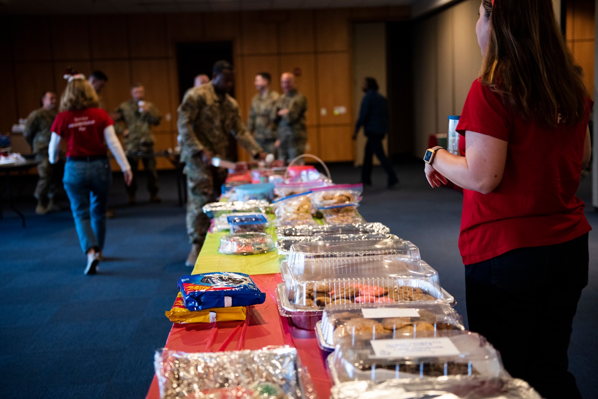 Members of the Tyndall Spouses Club and the Tyndall First Sergeants held a Cookie Caper event at Tyndall Air Force Base, Florida, Dec. 9, 2019. Hundreds of cookies where donated to the event, and were hand delivered to Airmen living in the on base dormitories. Extra cookies were distributed across the base to units and offices. (U.S. Air Force photo by Staff Sgt. Magen M. Reeves)