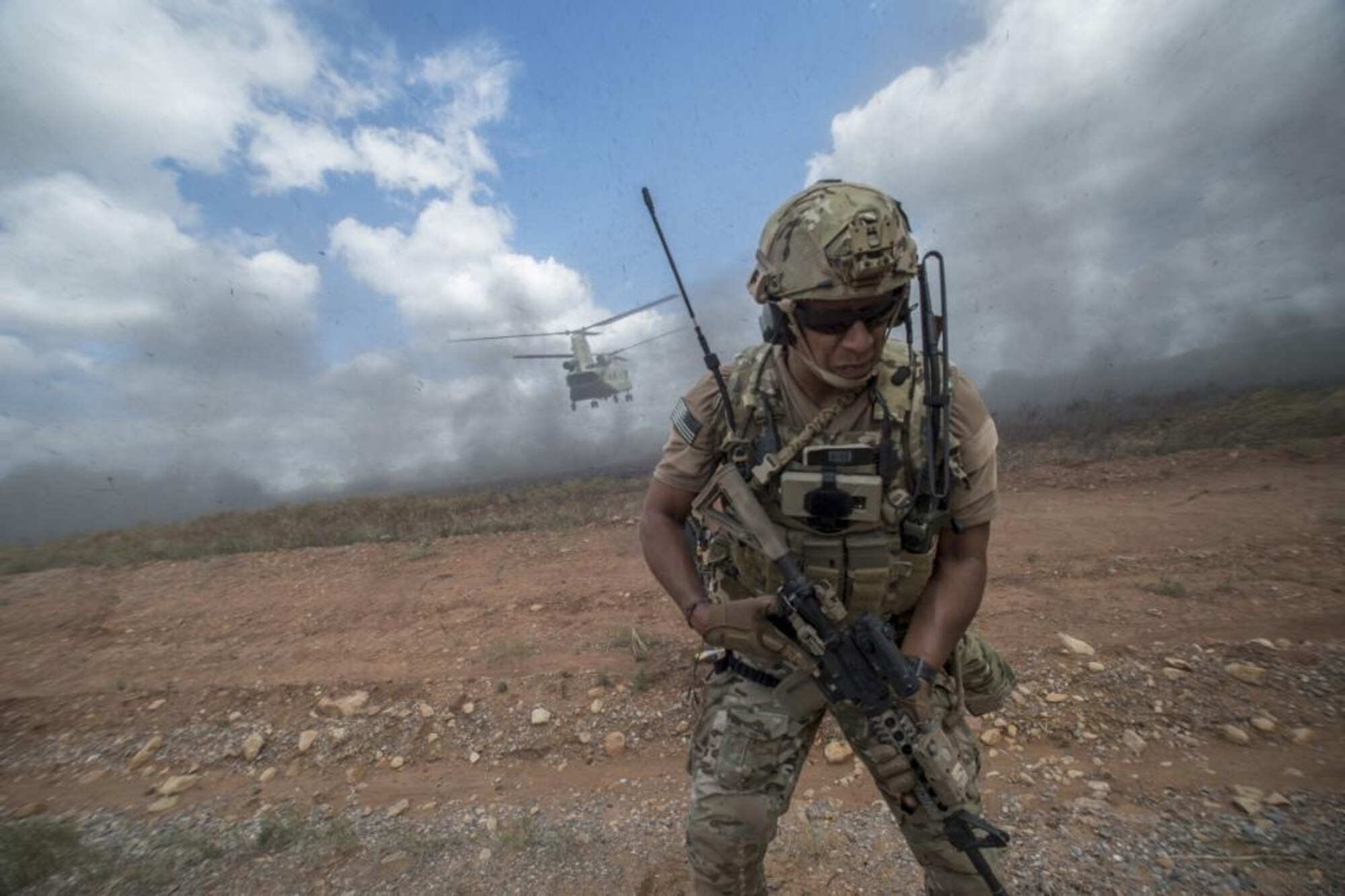 A Joint Terminal Attack Controller of the 137th Special Operations Wing, Oklahoma Air National Guard, solidifies his plan of action for a combat search and rescue mission prior to boarding a CH-47 Chinook. The SENTRY REX 19-02 training mission assault force was supported by E-3AWACS, E-8 J-STARS, MC-12 W Liberty and KC-135 Stratotankers. (Courtesy Photo)